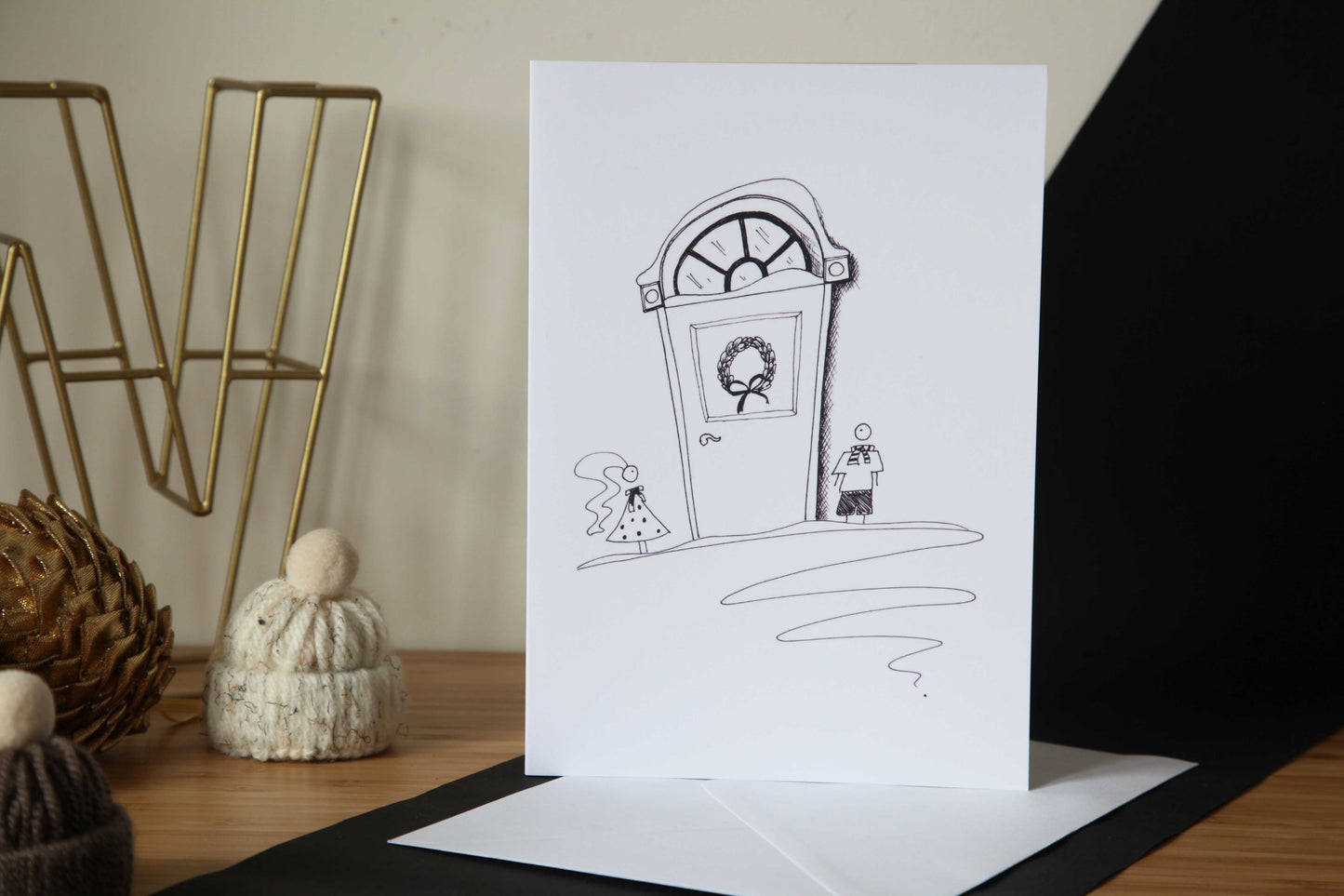 Christmas Card - little boy and girl at a Christmas door